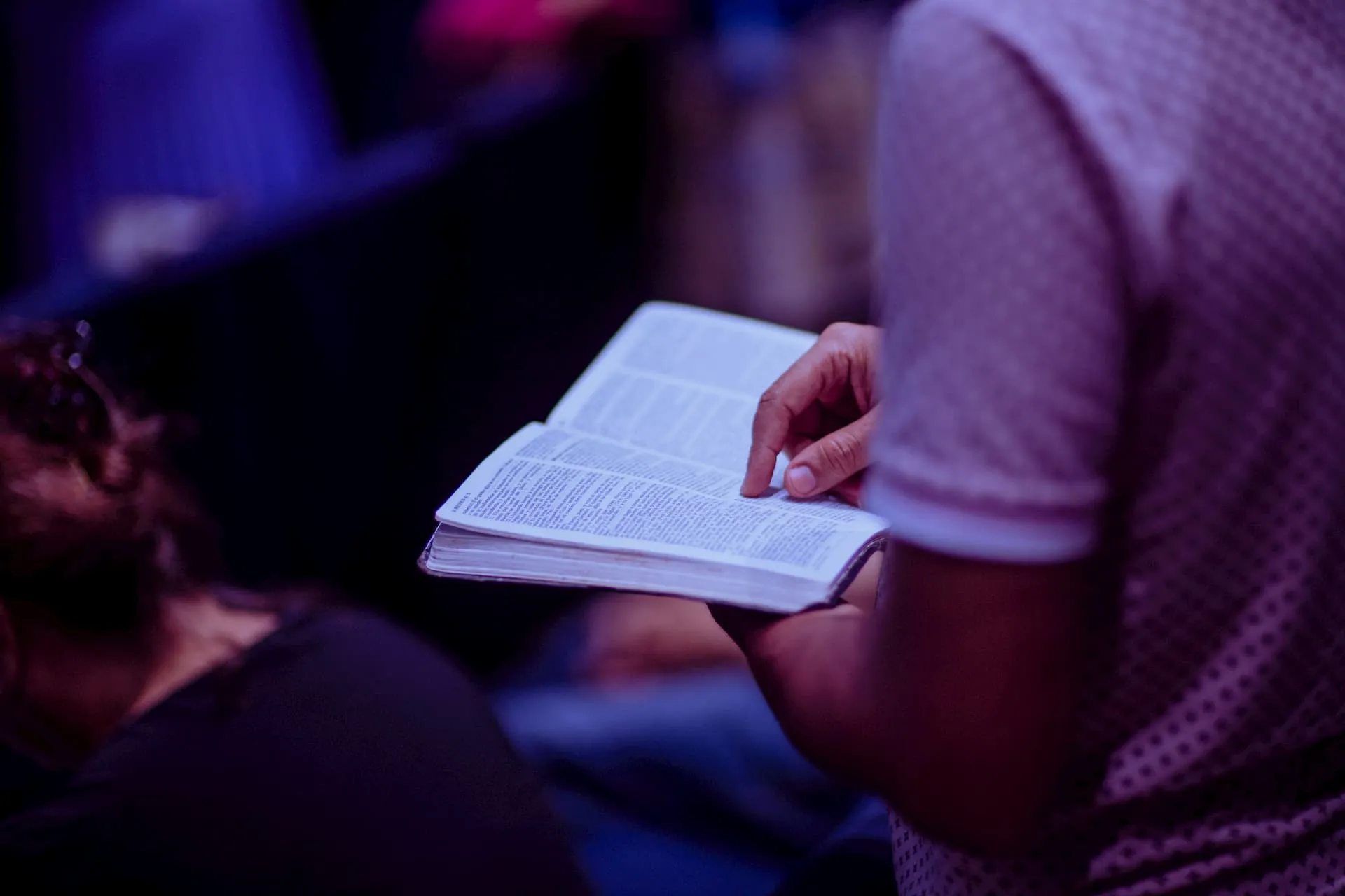 Guy reading the Bible up close